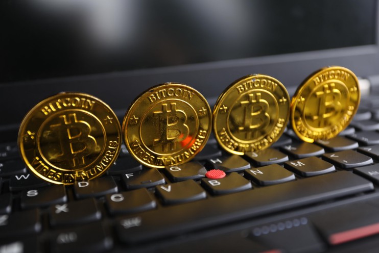比特币期货诞生  价格波动成交易难题_金融_电商报